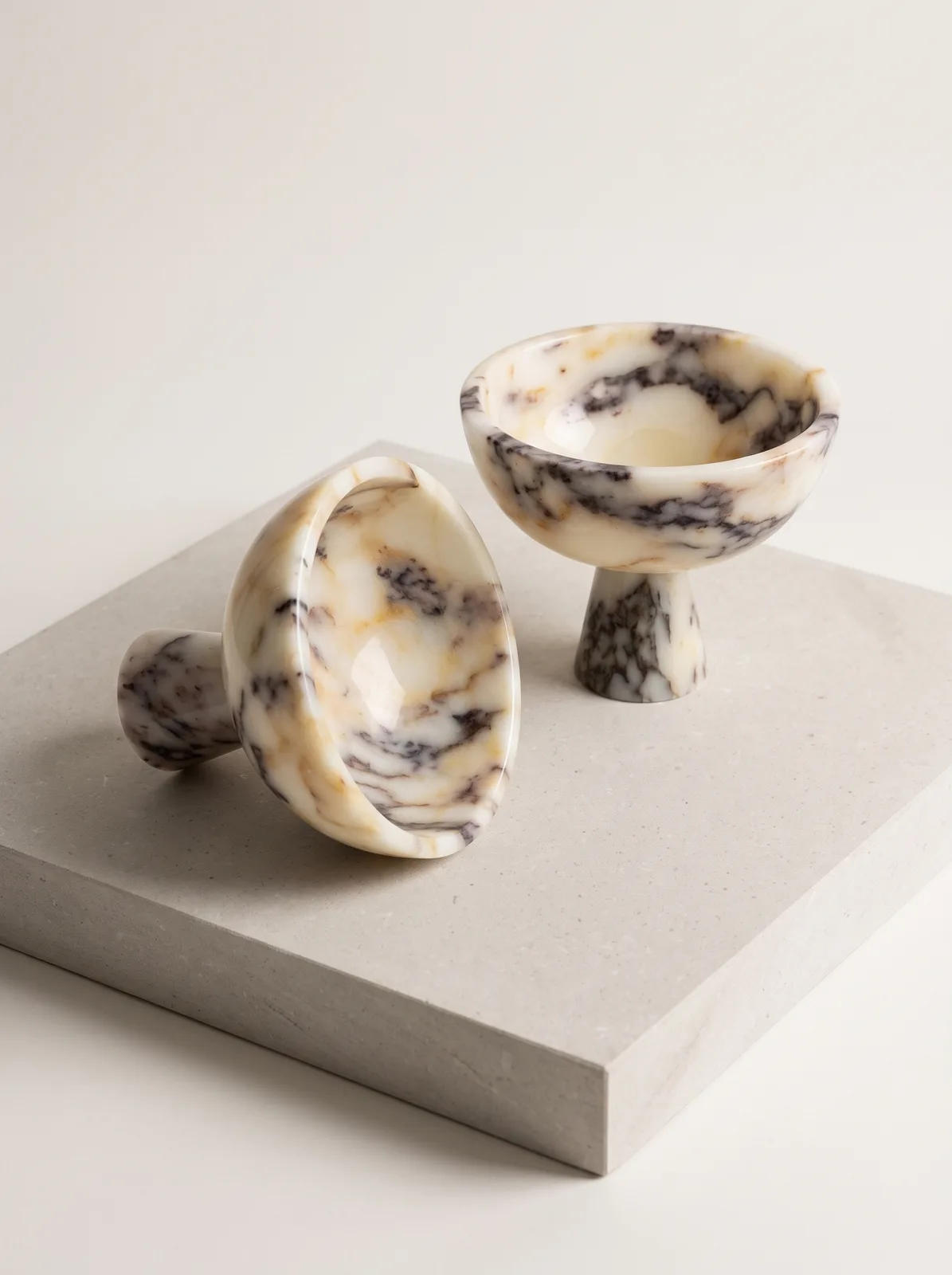 Pedestal fruit bowl in Calacatta Viola marble with violet veining