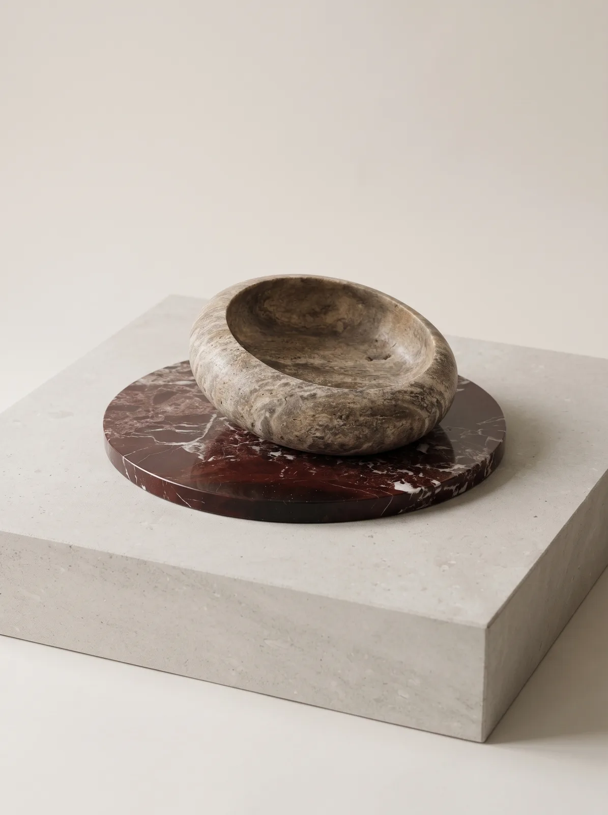 Serving bowl carved from silver travertine, showing layered grey striping
